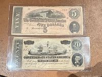 Both 1864 Confederate notes in protective sleeves