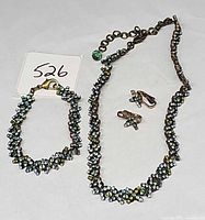 Full view of necklace, bracelet and earrings set