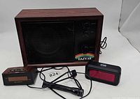 Front view of radio, two alarm clocks and flashlight