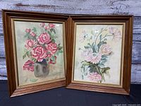 Both framed watercolor paintings side by side