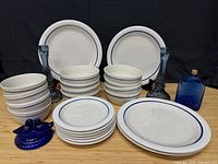 Full lot showing Gibson stoneware pieces and blue glass items