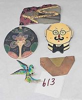 All five brooches arranged together