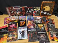 All DVDs and plaque laid out on table