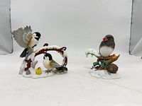 Two Lenox porcelain bird figurines displayed together