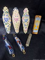 All seven mezuzah cases laid out