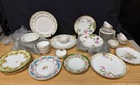 Group shot of all plates, cups and saucers