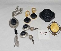 Full lot showing necklace, two pairs of earrings and two cameo brooches