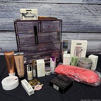 Lot overview showing organizer and assorted new beauty products