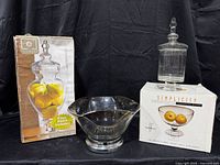 All three glass items with their boxes displayed