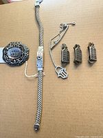 All six sterling silver pieces laid out