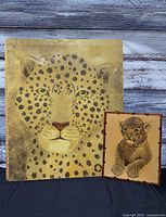 Both leopard artworks side by side