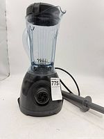 Full view of Vitamix ONE blender with tamper