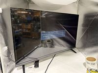 Front angled view of Vizio 39-inch TV displaying 'No Signal' message