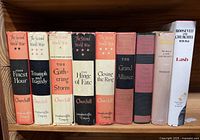 Spine view of nine Churchill related hardcovers on shelf