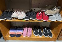 Overall view: six pairs on top shelf, four on bottom shelf