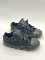 Pair of black low-top Converse shoes top and side views