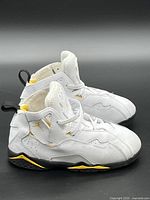 Side view of both shoes displaying upper, midsole accents and general wear