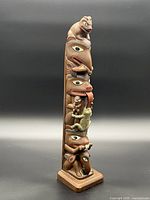 Full view of carved totem pole front