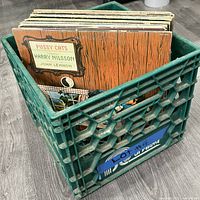 Crate filled with vinyl records, front record Harry Nilsson “Pussy Cats”