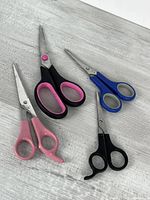 All four pairs of scissors on tabletop