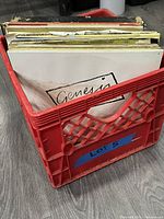 Red crate filled with LPs, blue tape marked Lot 5