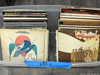 Plastic tote filled with many LP records, front sleeves visible: Eagles On The Border; Led Zeppelin II