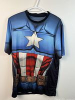 Front view of Captain America armour T-shirt on hanger