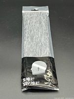 Front of sealed TeknixSport Sport Support headband package showing grey fabric and branding