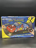 Front of box showing Jeff Gordon #24 Operation Pit Stop game