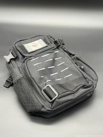 Full view of black tactical sling bag front