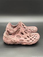 Right side view of both clogs showing perforations and heel straps