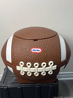 Front view of football-shaped Little Tikes toy box