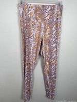 Front view of leggings showing snake print and full length