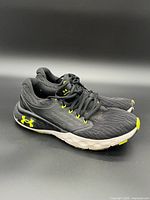 Side profile of both shoes showing logo, color scheme and sole condition