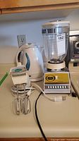 All three appliances grouped: blender, hand mixer, electric kettle