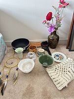 Mixed decorative items grouped on floor
