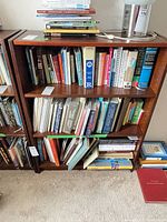 Front view showing bookcase filled with books