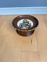 Full view of wooden musical pedestal showing medallion design