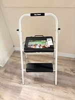 Front view of Easy Reach 2-step folding step stool showing frame and steps