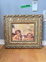 Front view of framed cherub print