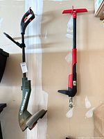 Full view of both tools hanging on wall