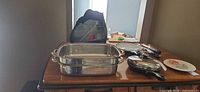overview showing roasting pan, skillet, storage containers bagged