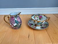 Teacup, saucer and creamer full view