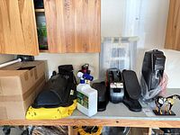 SodaStream maker, bottle, mini stepper, painted horse figurine on shelf