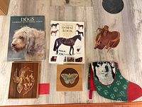 All items laid out: wooden box, two books, saddle, butterfly plaque, stocking