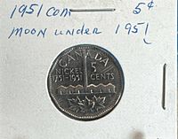 Reverse of 1951 Canadian 5 cents showing Moon Under variety