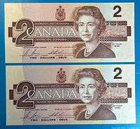 Obverse of both $2 notes showing portrait, denomination, signatures