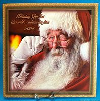 Front cover of 2004 Holiday Gift Set folder featuring Santa image