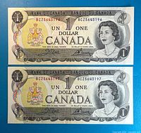 Both 1973 $1 Canadian banknotes full view