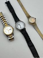 Group shot of three wrist watches showing overall styles and bracelets